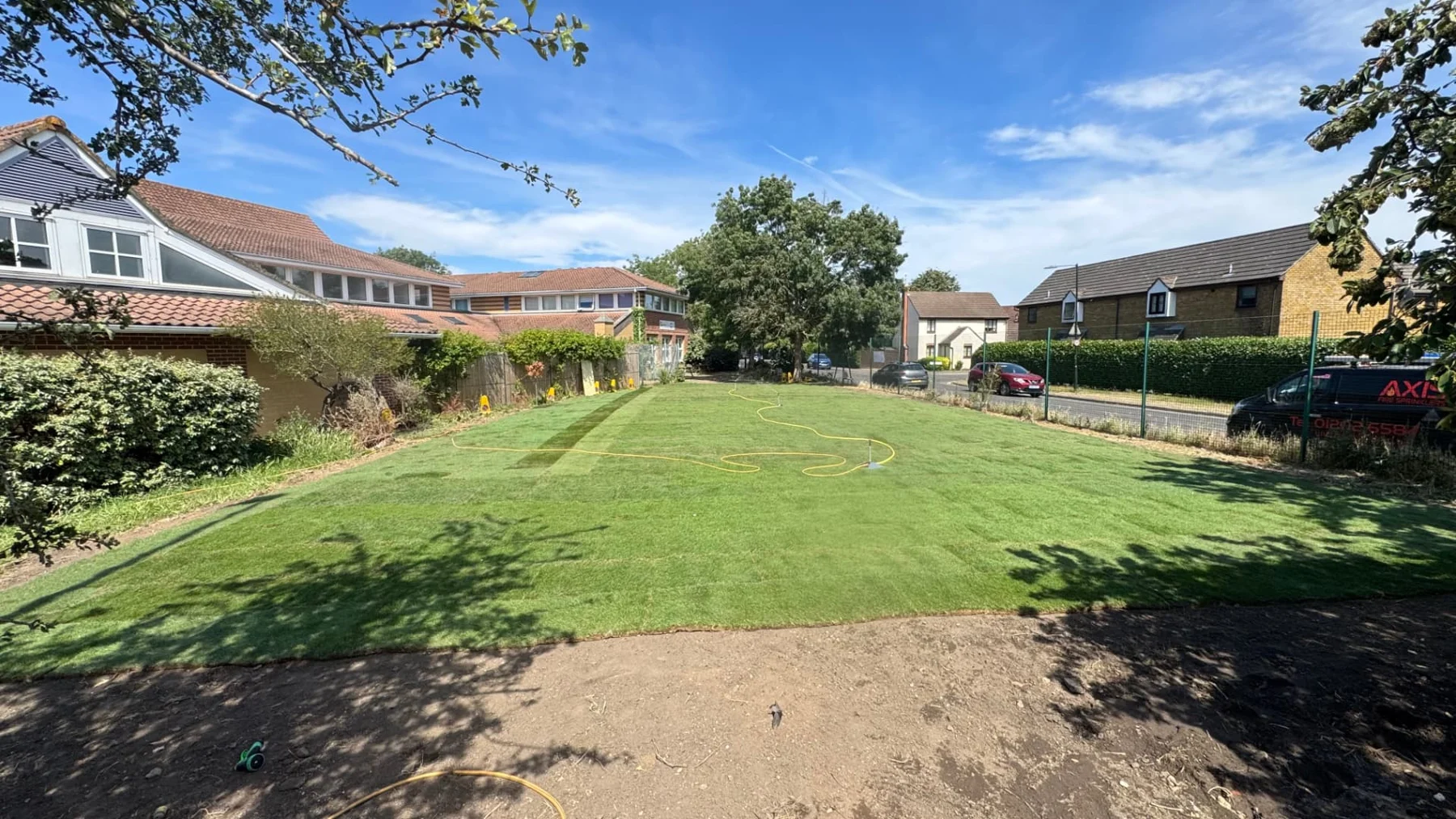 Newly laid lawn and planted borders in a residential garden